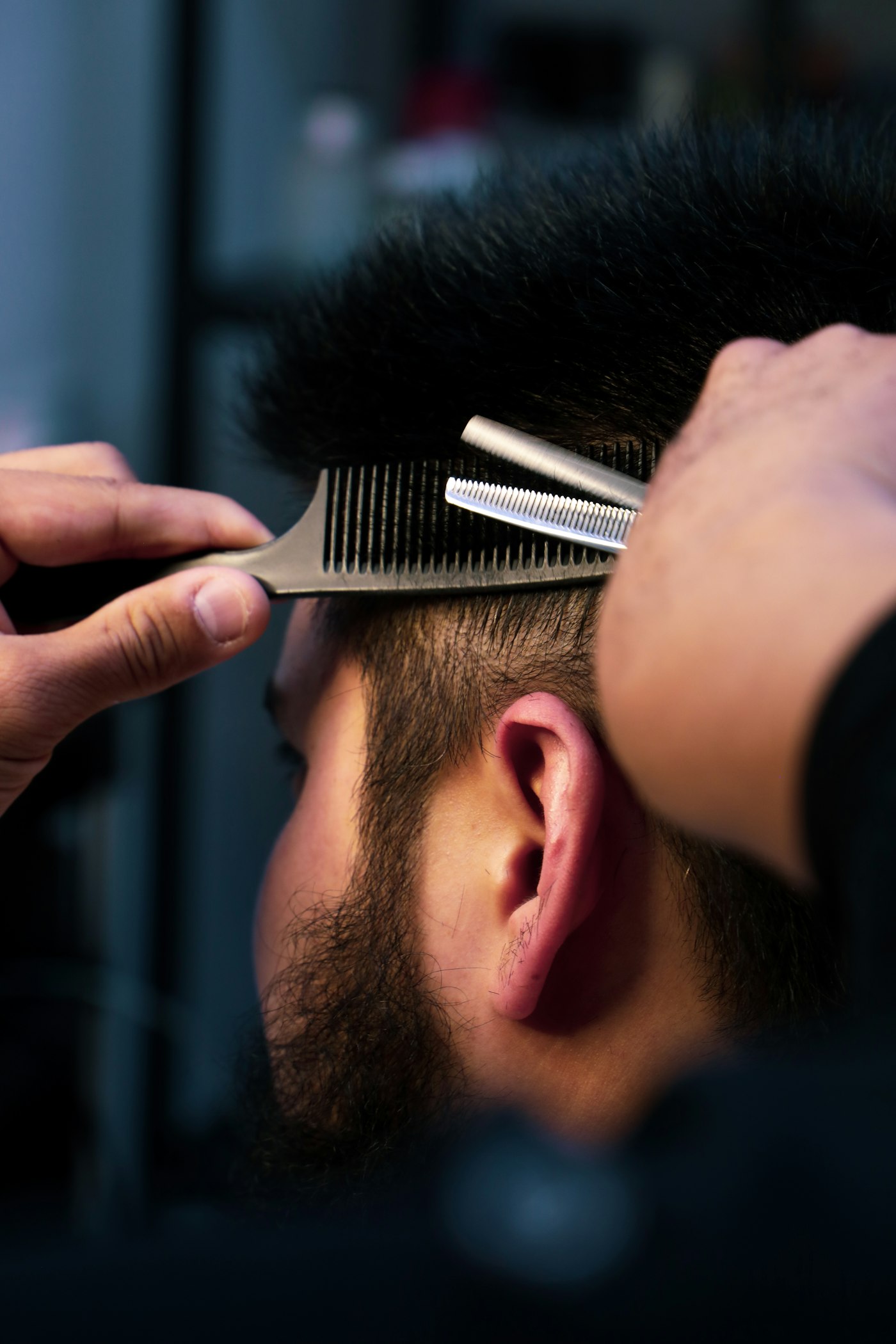 Detailed close-up of a comb and a freshly cut fade